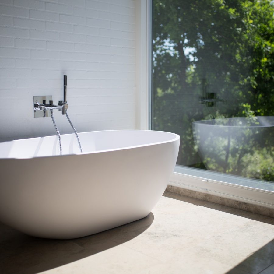 white-ceramic-bathtub-beside-clear-glass-wall-1358912